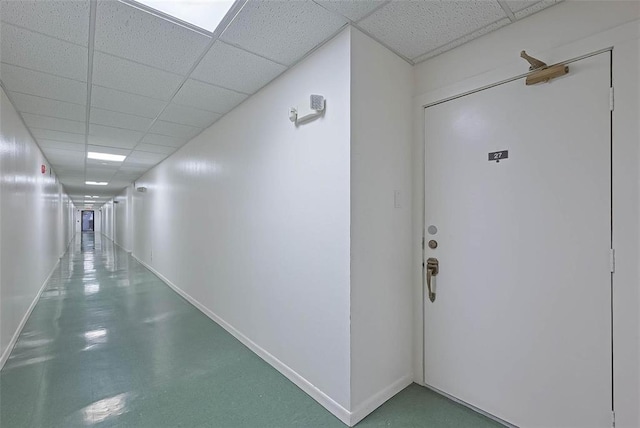 corridor featuring a paneled ceiling