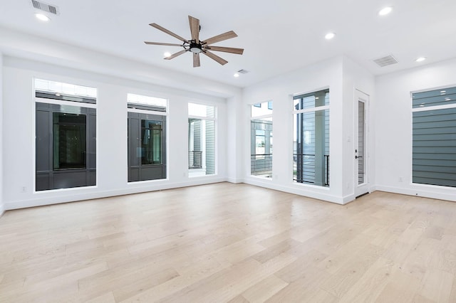 unfurnished room with ceiling fan and light hardwood / wood-style floors