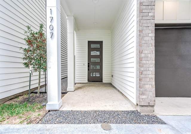 entrance to property featuring a garage