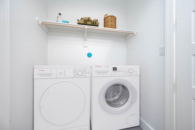 laundry room with independent washer and dryer