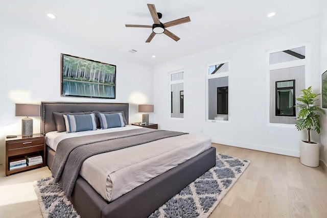 bedroom featuring light hardwood / wood-style flooring and ceiling fan