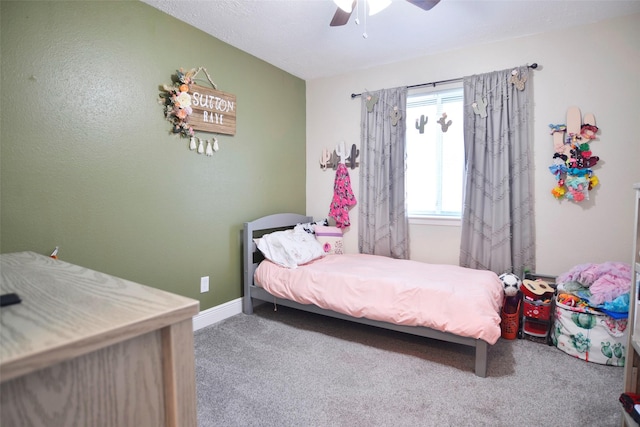 carpeted bedroom featuring ceiling fan