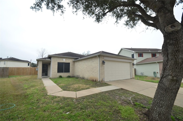 view of front of house with a garage and a front yard