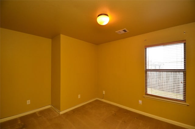 empty room featuring carpet floors