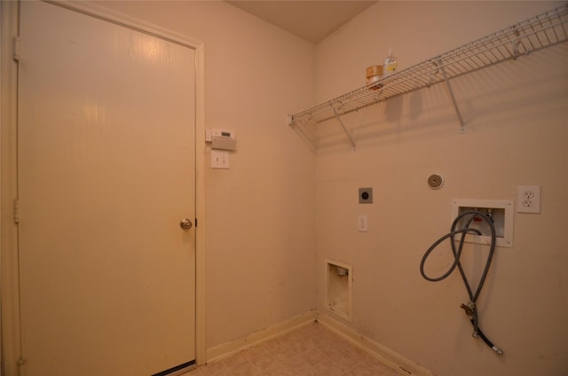 washroom with hookup for a washing machine, electric dryer hookup, and hookup for a gas dryer