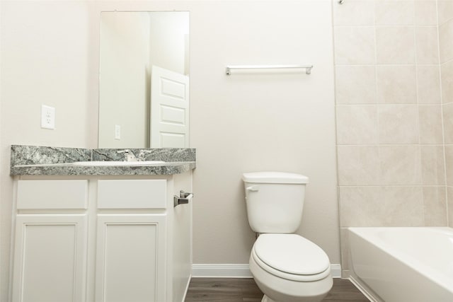 full bathroom with vanity, wood-type flooring, shower / bathtub combination, and toilet