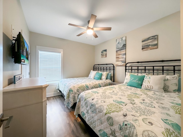 bedroom featuring dark wood-type flooring and ceiling fan