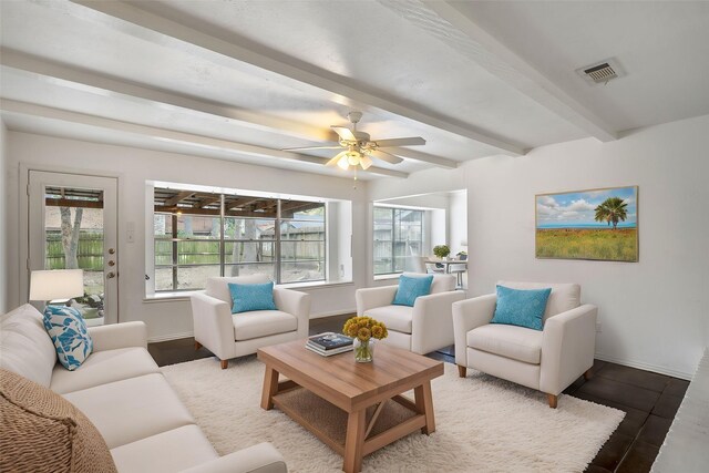 living room with beamed ceiling and ceiling fan