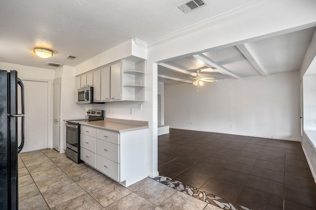 kitchen featuring tile patterned floors, a textured ceiling, ceiling fan, stainless steel appliances, and beam ceiling