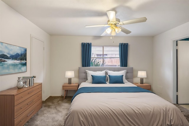 bedroom with light carpet and a ceiling fan