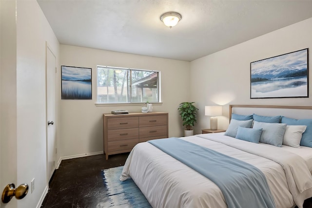 bedroom featuring baseboards