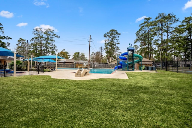 communal playground with a patio area, a lawn, a community pool, and fence