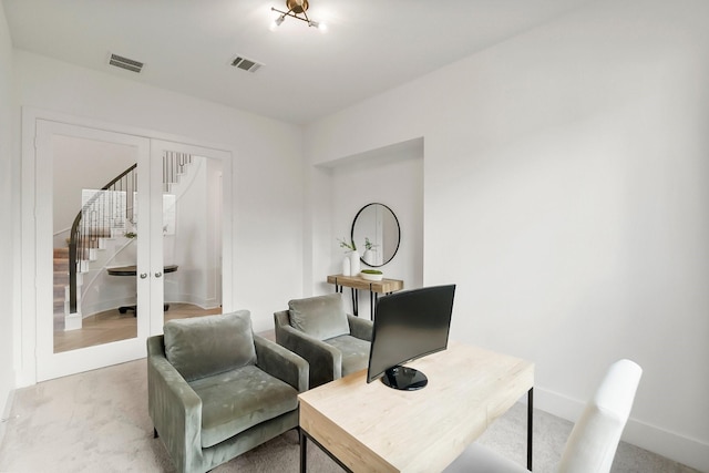 home office featuring light carpet and french doors