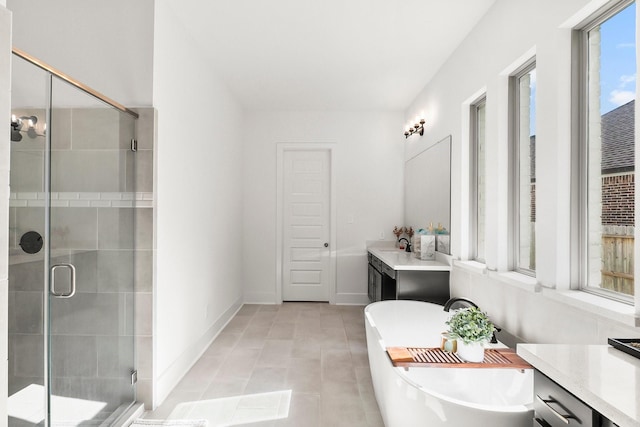 bathroom featuring vanity, tile patterned floors, and plus walk in shower