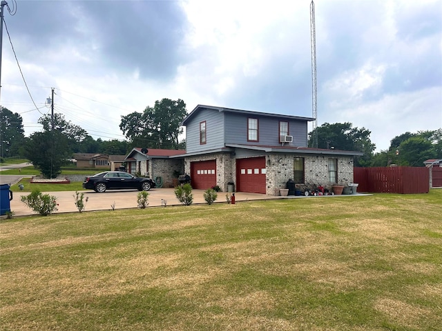 view of front facade with a garage, cooling unit, and a front lawn