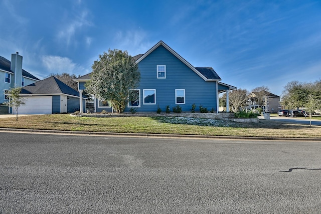 2106 Springwood, Brenham, TX 77833 - traditional home with a garage and a front lawn