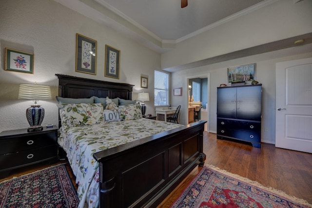 2106 Springwood, Brenham, TX 77833 - bedroom featuring ornamental molding, dark wood-style flooring, a ceiling fan, and ensuite bath