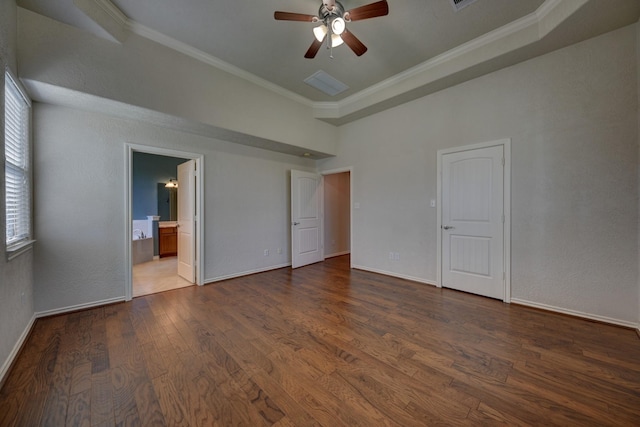 2106 Springwood, Brenham, TX 77833 - unfurnished bedroom featuring ornamental molding, wood finished floors, baseboards, and connected bathroom