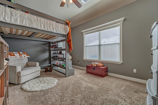 bedroom featuring lofted ceiling, carpet floors, and ceiling fan