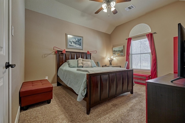 carpeted bedroom with vaulted ceiling and ceiling fan