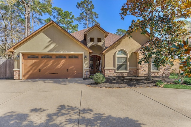 view of front facade featuring a garage and french doors