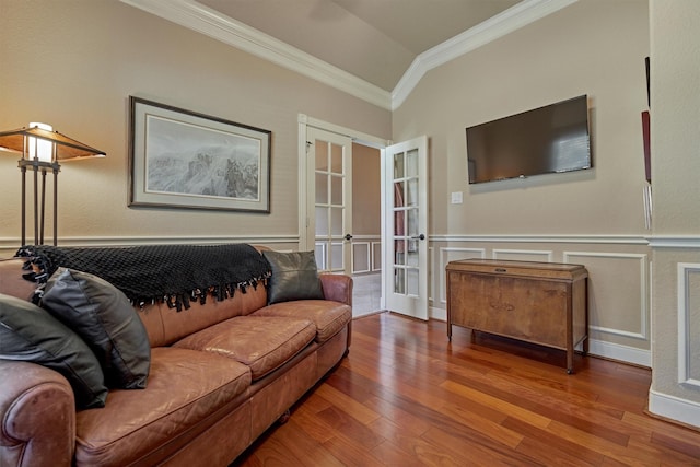 living room with crown molding, vaulted ceiling, french doors, and hardwood / wood-style flooring