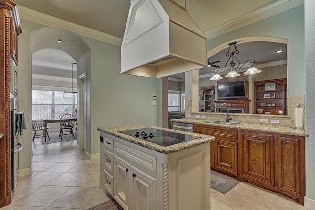 kitchen featuring light tile patterned flooring, a kitchen island, sink, ornamental molding, and black electric stovetop