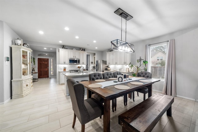 dining space featuring sink