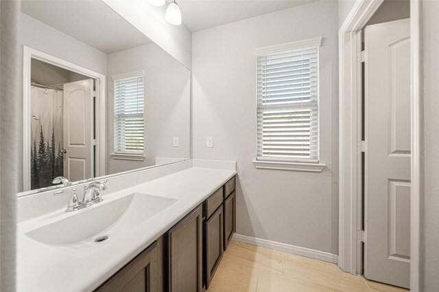 bathroom with vanity and a wealth of natural light