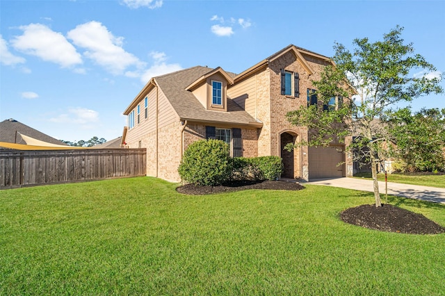 view of front property with a garage and a front yard