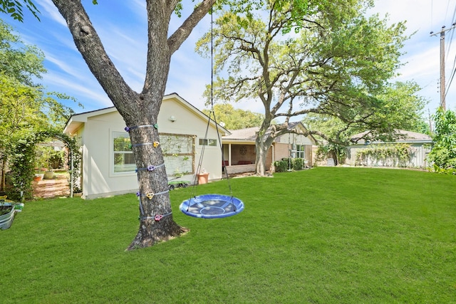 rear view of house with a yard