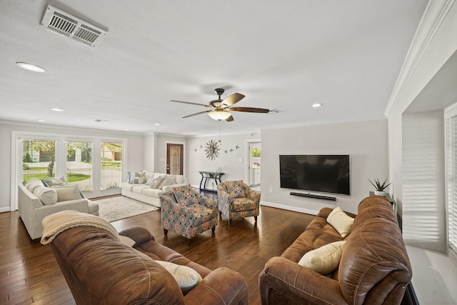 living room with crown molding, dark hardwood / wood-style floors, and ceiling fan