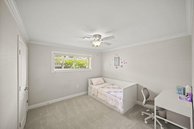 carpeted bedroom with ornamental molding and ceiling fan