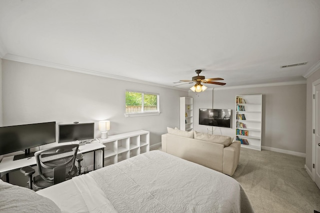 bedroom with carpet floors, ornamental molding, and ceiling fan