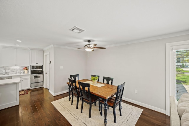 dining space with crown molding, dark hardwood / wood-style floors, and ceiling fan