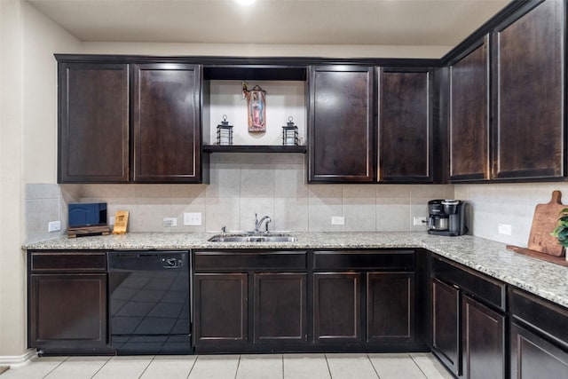 kitchen featuring sink, dark brown cabinets, light stone countertops, and dishwasher