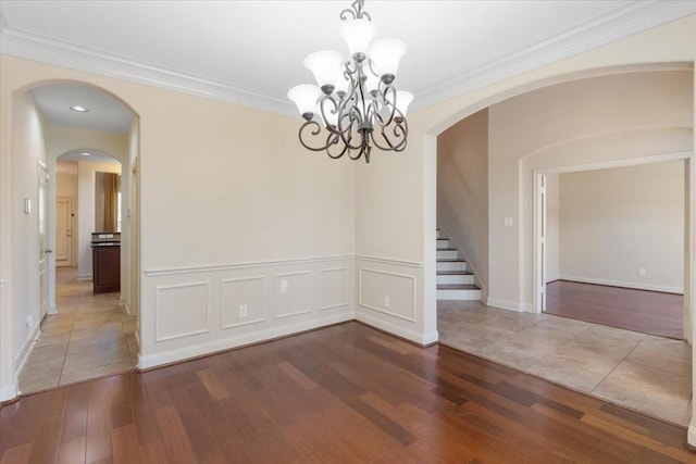 unfurnished room with crown molding and hardwood / wood-style floors