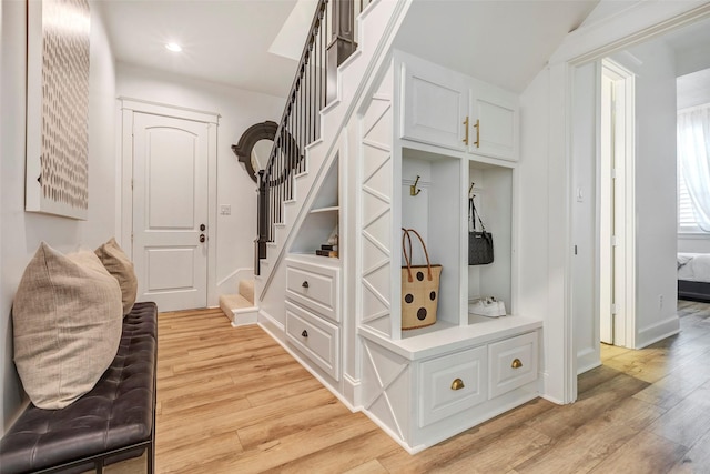 mudroom with light hardwood / wood-style floors