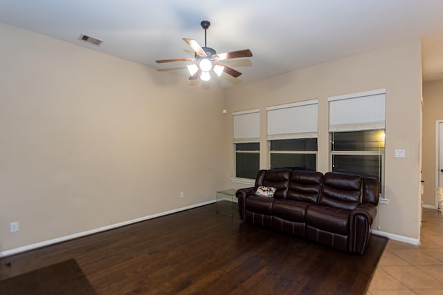 living room with hardwood / wood-style floors and ceiling fan