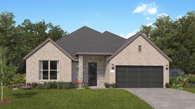 view of front of property with a garage and a front lawn