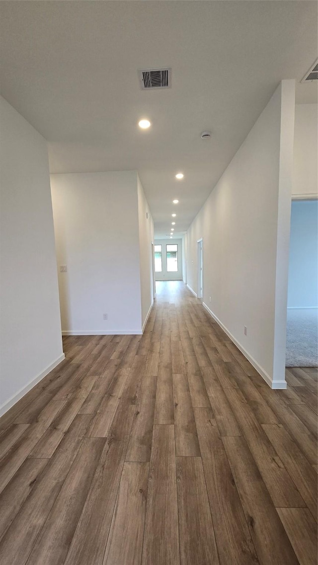 unfurnished room featuring hardwood / wood-style floors