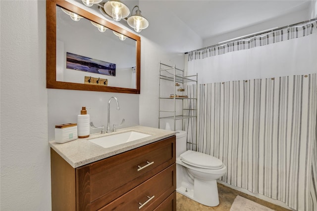 bathroom with vanity, walk in shower, and toilet