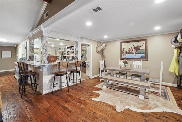 2120 Fm 1406th Rd, Winnie, TX 77665 - interior space with hardwood / wood-style floors, visible vents, crown molding, and baseboards