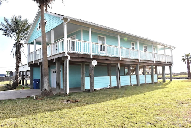 rear view of property with a yard