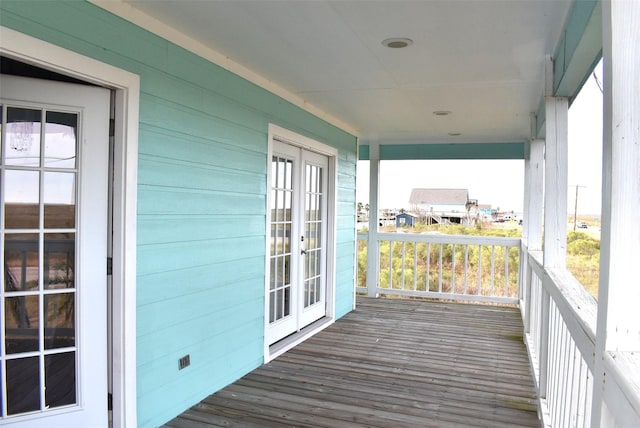 wooden deck featuring french doors