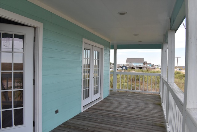 wooden deck featuring french doors