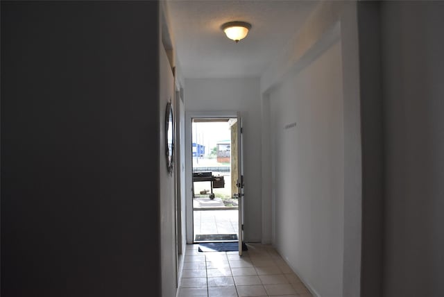 corridor with light tile patterned floors