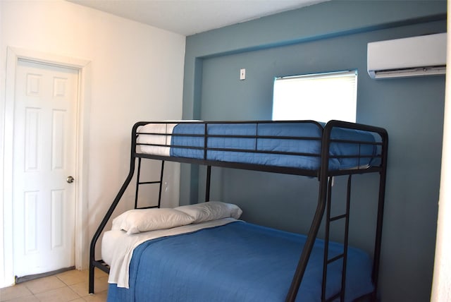 tiled bedroom featuring a wall mounted AC