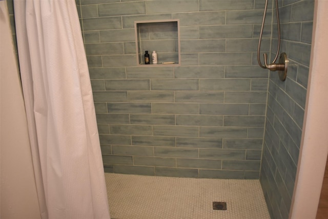 bathroom with a shower with shower curtain