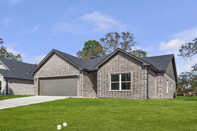 view of front of home with a garage and a front lawn